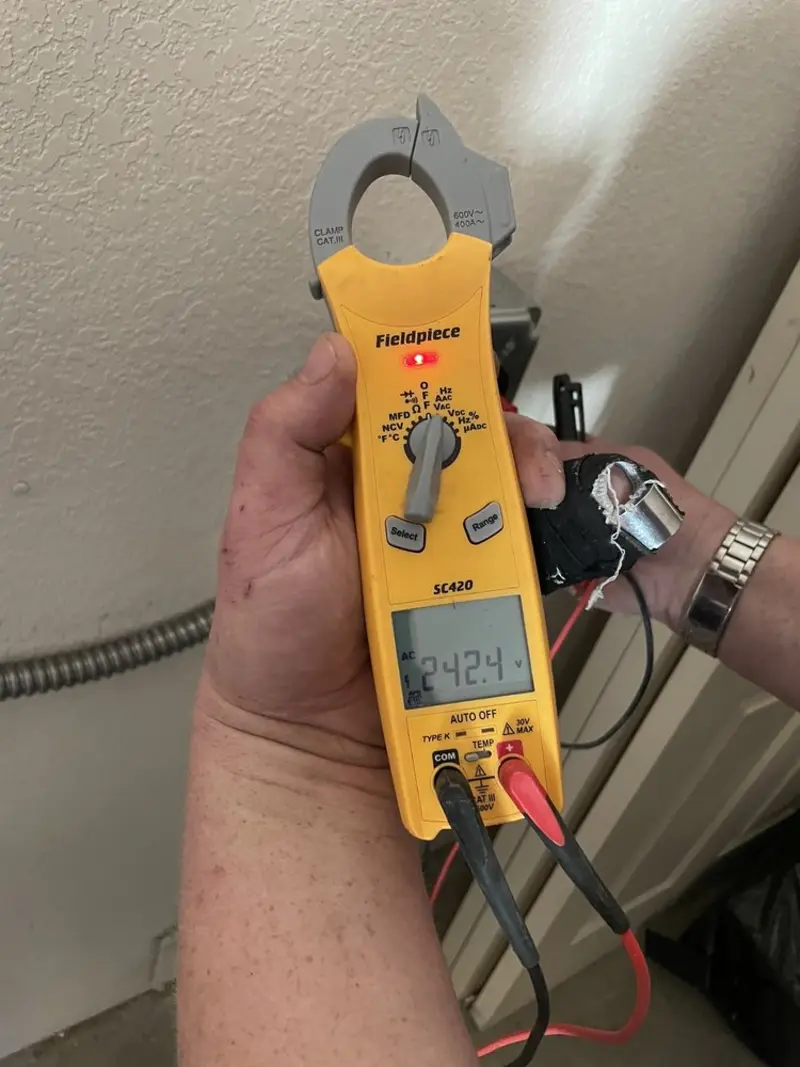 Voltage testing with clamp meter during Electrical Installation Services in Hoschton